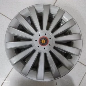 قالپاق طرح رینگ 15 پره ای ماشین مدل اوپتیمایی رنگ نقره ای اسپرت مناسب انواع خودرو با سایز 15 اینچ